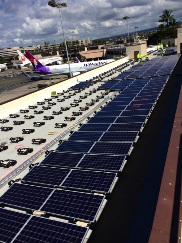 REC Solar installed 2.474 MW at Honolulu International and Kahului Airports, which included both Trina Solar and JA Solar modules. Not only in a hurricane-prone region that requires detailed wind load testing for solar, the area's salty and humid climate made Renusol's non-corrosive plastic material mounting system imperative. (Credit: Renusol)