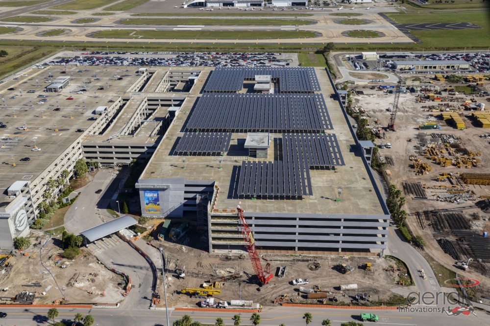 Tampa Electric (TECO) installed its first utility-scale system in 2015 at Tampa International Airport. The 2-MW parking canopy is on top of a parking garage. Florida's Solar Source installed the project, which is a one-of-a-kind concrete structure. (Credit: Solar Source)