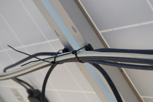 Wires under solar panel